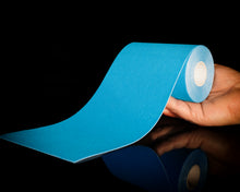 Load image into Gallery viewer, Ocean Blue™ Hestaband™ Cotton kinesiology tape roll displayed on a black background with premium recovery-focused styling.
